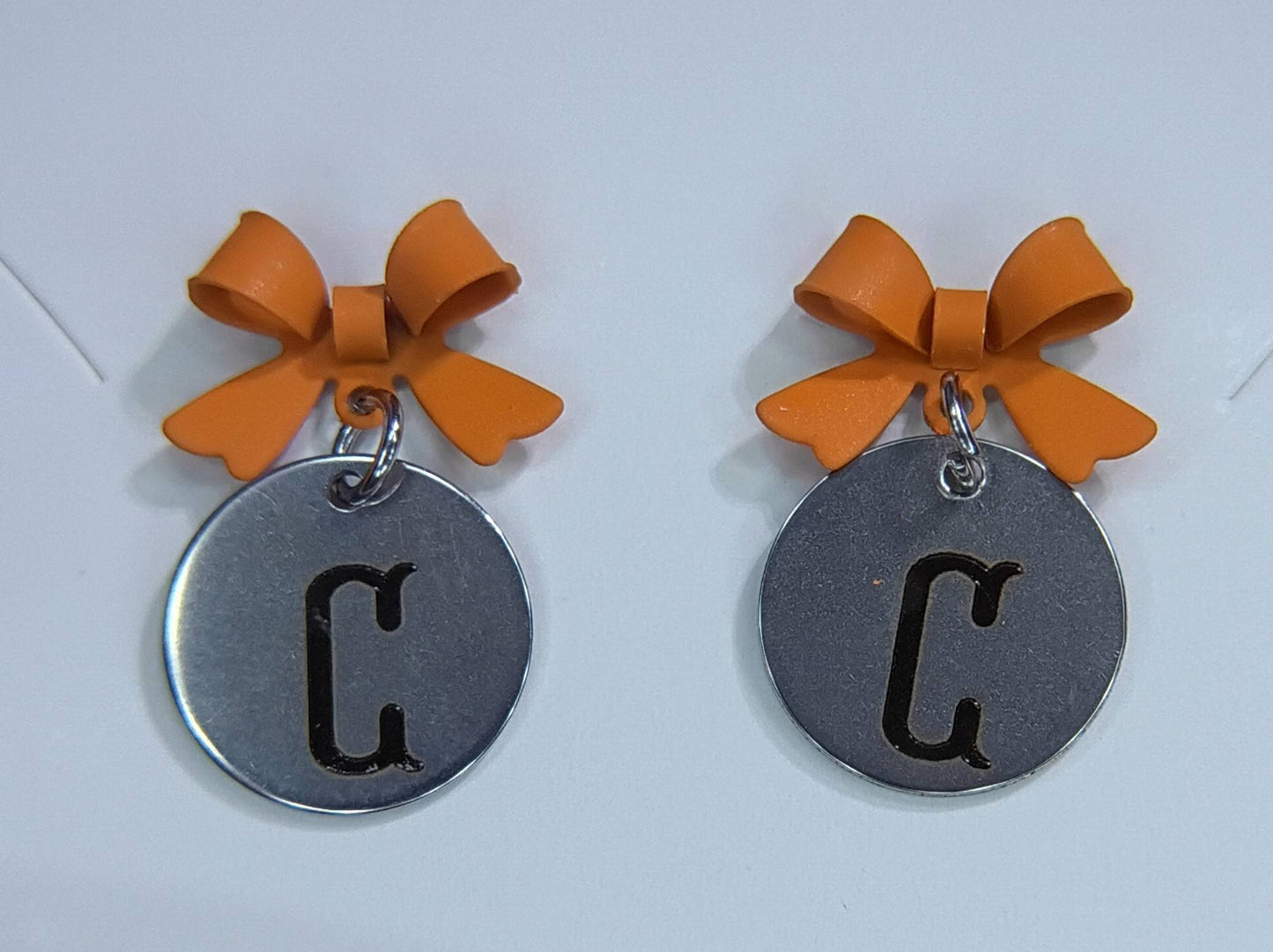 Orange (Letter C) bow stud earrings
